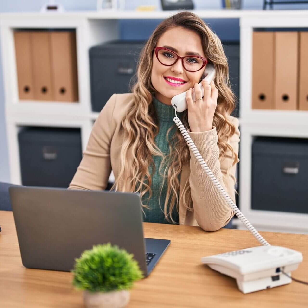 Young Woman Business Worker Talking On Telephone At Office